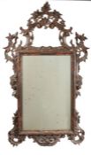 19th Century gilt framed wall mirror, the pierced scroll and foliate frame housing the mirror plate,