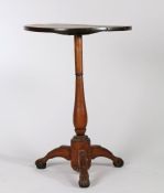 19th Century primitive table, possibly Isle of Man, the circular top raised on a vase turned stem,