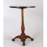 19th Century primitive table, possibly Isle of Man, the circular top raised on a vase turned stem,