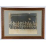 Framed early 20th Century photograph of a Platoon of British Soldiers in Foreign Service uniform,