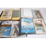 Collection of folders containing aviation ephemera including WW2 aircraft prints, vintage aircraft