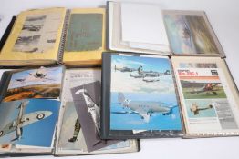 Collection of folders containing aviation ephemera including WW2 aircraft prints, vintage aircraft