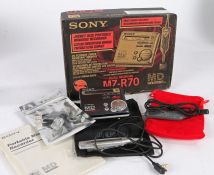 Sony MZ-R70 Walkman Portable Minidisc Recorder with cables and plug in speakers housed with in the