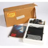 Sinclair ZX81 computer with programming book