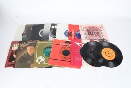Approx. 15 Rock and Pop 7" singles and 4 flexi discs
