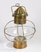 20th century brass ships lamp, with a brass funnel design top above a bulbous glass body, 39cm high