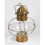 20th century brass ships lamp, with a brass funnel design top above a bulbous glass body, 39cm high