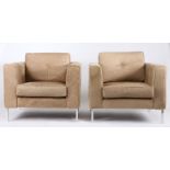 Pair of Italian pony skin armchairs, each of square form with drop in cushions, raised on chrome