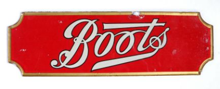 Mid 20th century reverse painted glass 'Boots' advertising sign, the lettering on a red ground