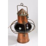 20th century copper ships lamp, with a copper funnel design top above a bulbous red glass body