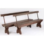 Pair of pine and iron swing back tram benches, each having pine back rests and seats, the iron