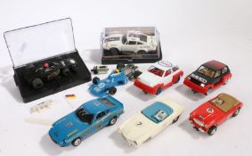 Collection of eight Scalextric cars, to include two Hornby Hobbies rally cars, a JPS Lotus 77,