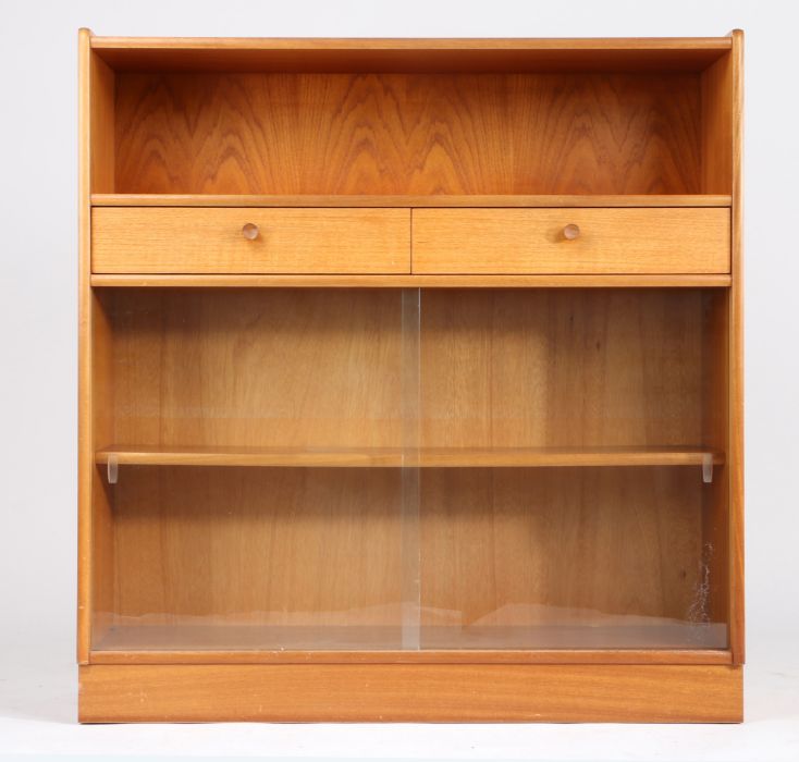 Nathan teak bookcase, with open top above two drawers and a pair of sliding glass doors, 102cm wide,