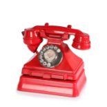 Mid 20th century G.P.O. rotary dial telephone, in red, for Coltishall, with pull out tray and stand