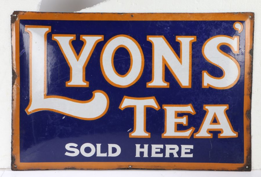 Lyons enamel advertising sign, with white lettering highlighted in orange, on a navy blue ground,