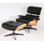 1960's style lounge chair and footstool, after a design by Charles and Ray Eames, with black leather
