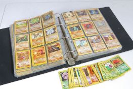 Large collection of Pokemon cards, housed in a Pokemon Trading Card Game album, and a black