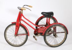 Child's red painted tricycle, mid 20th century, chrome handle bar and black seat