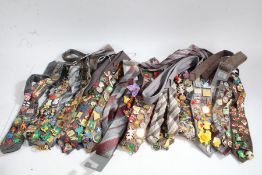 Large collection of pin badges on ties, to include well known characters and places (qty)
