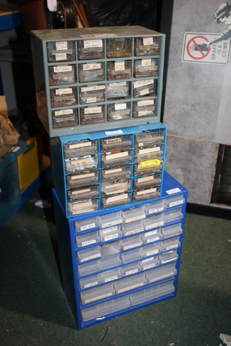 Three metal table top chests, containing screws, nails and hardware (3)