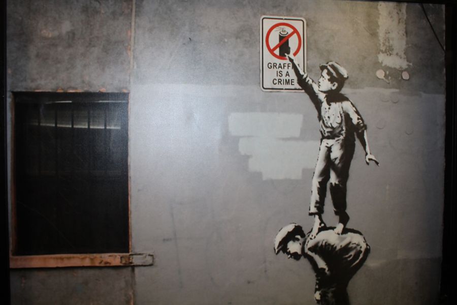 After Banksy, print on canvas 'Balloon Girl', and 'Graffiti is not a crime', together with a large