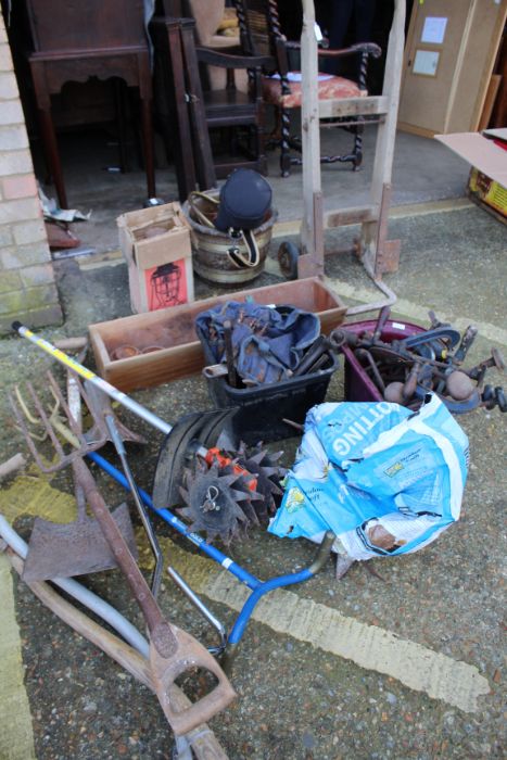 Collection of tools, to include long handled tools, scarifier, wooden sack barrow, clamps, spanners,