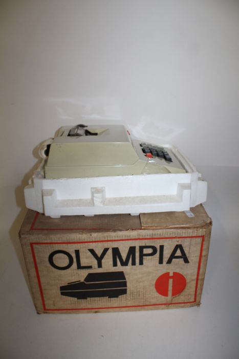 Olympia adding machine, in original box