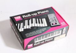 Pure Tone roll-up piano. Boxed and unused.
