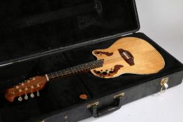 Ovation OP-24 Plus Electro-Acoustic Mandolin, cased with various accessories.