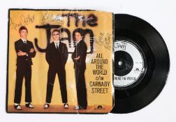 The Jam - All Around The World c/w Carnaby Street. Bearing signatures of Paul Weller, Bruce Foxton,