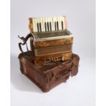 Mastertone Foreign Piano Accordion and a brown case.