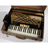 Hohner Virtuola III Piano Accordian in black, with case.