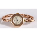 9 carat gold cases J W Benson wristwatch, the octagonal case set with a white dial Arabic