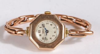 9 carat gold cases J W Benson wristwatch, the octagonal case set with a white dial Arabic