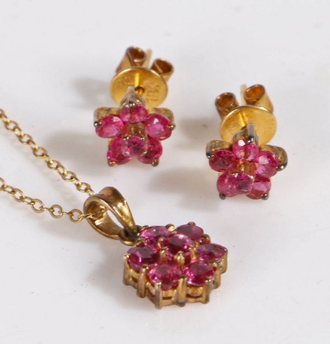 9 carat gold chain link necklace set with a floral pink stone pendant together with a similar pair