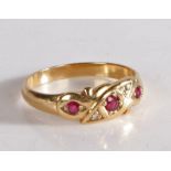 9 carat gold ruby and diamond gypsy style ring, the head set with three claw mounted round cut rubys