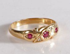 9 carat gold ruby and diamond gypsy style ring, the head set with three claw mounted round cut rubys