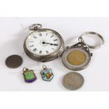 White metal pocket watch set with a white dial and Roman numerals together with three coins and