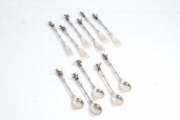 Set of six Dutch white metal cake forks and five matching tea spoons, the handles cast as musicians,