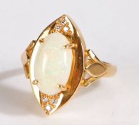 White opal diamond and yellow metal ring, set with a large claw mounted white opal together with six