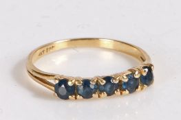 14 carat gold and sapphire ring, the head set with five claw mounted round cut sapphires, weight 1.6