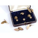 Two sets of yellow metal collar studs together with a pair of cuff-links, gross weight 15.26 grams
