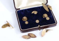 Two sets of yellow metal collar studs together with a pair of cuff-links, gross weight 15.26 grams