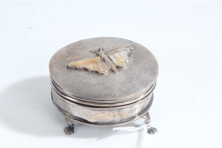 Silver trinket box, Birmingham marks rubbed, of oval form, the hinged lid with depiction of a