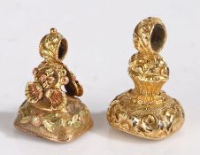 Two yellow metal and amethyst fob seals, both with foliate decoration and set with amethyst to the