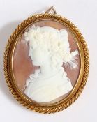 Yellow metal cameo brooch, the cameo depicting a classical lady together with a twisted unmarked