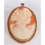 Yellow metal cameo brooch, depicting a classical lady with a chain effect mount, gross weight 13.8