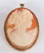 Yellow metal cameo brooch, depicting a classical lady with a chain effect mount, gross weight 13.8