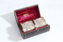 Pair of Victorian silver napkin rings, London 1893, makers marks rubbed, with cast foliate