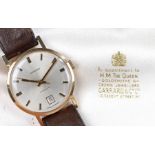 Garrard 9 carat gold gentleman's wristwatch, the signed silver dial with baton markers and date